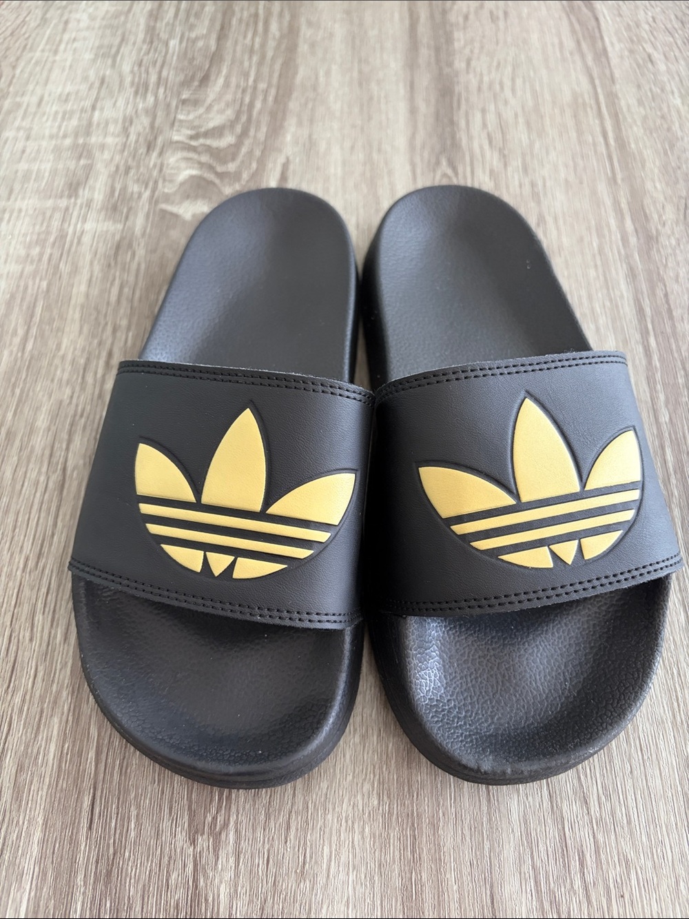 adidas Black Slides with Gold Trefoil Logo